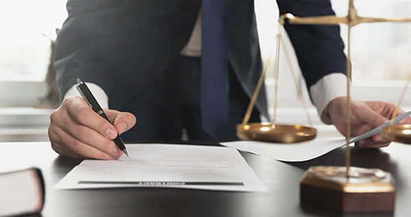 a person signing a document